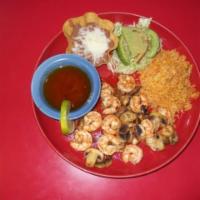 Mariscos al Mojo · Your choice of shrimp, scallops, or fish sauteed with mushrooms in a butter garlic sauce. (S...