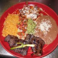 Carne Asada y Mas · Skirt steak marinated cooked to perfection and your choice of tamale, enchilada, Chile Relle...