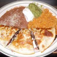 Fajitas Quesadilla · A flour tortilla filled with your choice of chicken or steak with cheese and pico de gallo. ...