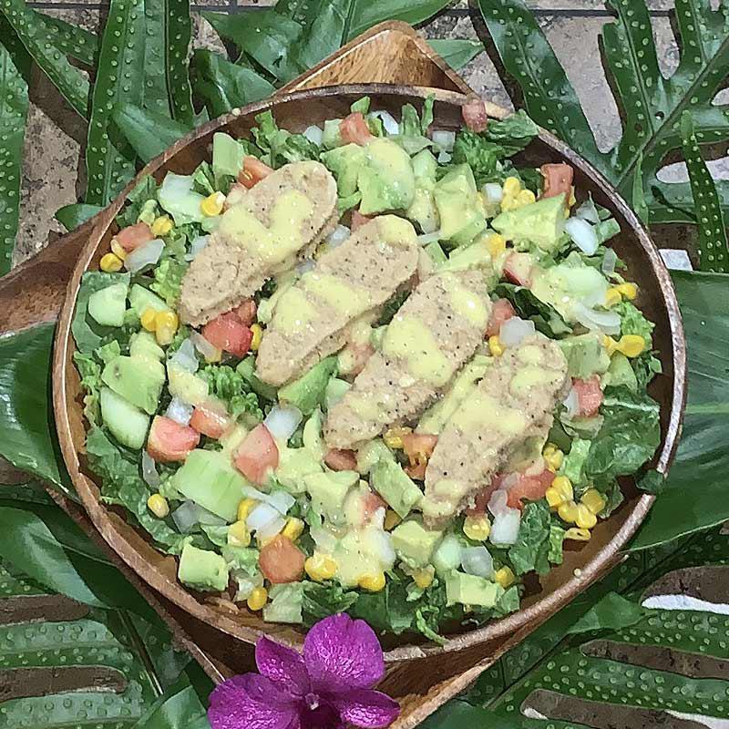 Vegetarian Cobb Salad Mini · Pure salad made with local cucumbers, lettuce, corn, tomatoes and avocados served with sweet onion dressing.