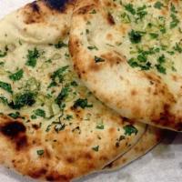 5. Garlic Naan · Leavened flour bread topped with fresh garlic.