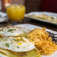 HUEVOS RANCHEROS · SPICY GREEN SAUCE SERVED ON TORTILLAS , TOPPED WITH FRIED EGGS TO CRISPY PERFECTION , ONIONS...