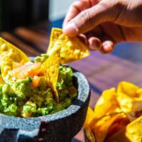 Homemade Guacamole · Mashed avocado, cilantro, lime, onion, jalapenos and tomato.