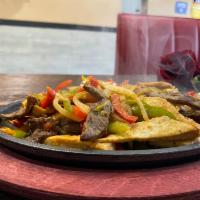 SIGNATURE FAJITAS WITH MIXED MEATS · STEAK, CHICKEN, SHRIMPS,  sautéed bell peppers and onions, saffron yellow rice, black beans ...