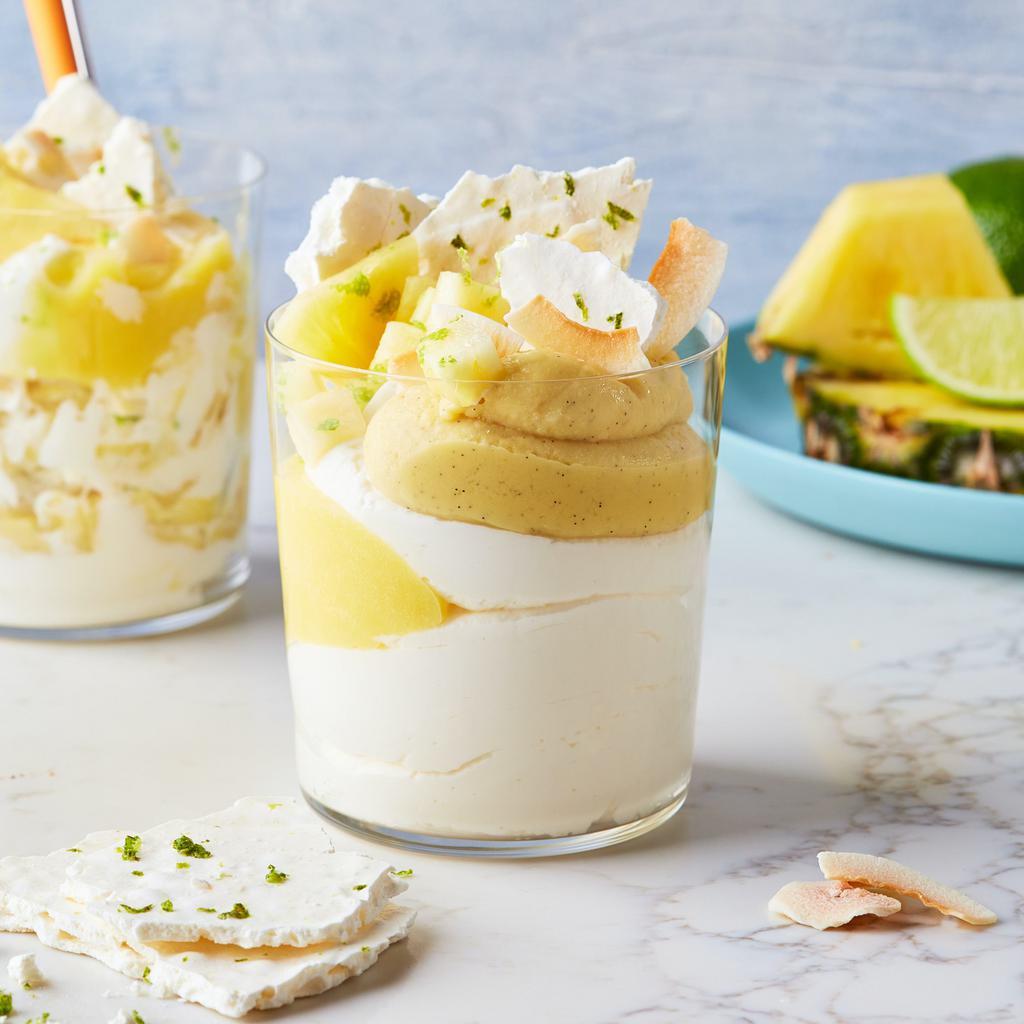 Roasted Coconut Mess · Enjoy our light and fluffy whipped crème fraiche layered with lime meringue, coconut cream, fresh pineapple, and crunchy coconut flakes | Allergen: Milk, Egg, Wheat