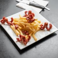 Salchipapas · French fries and sliced hot dog.