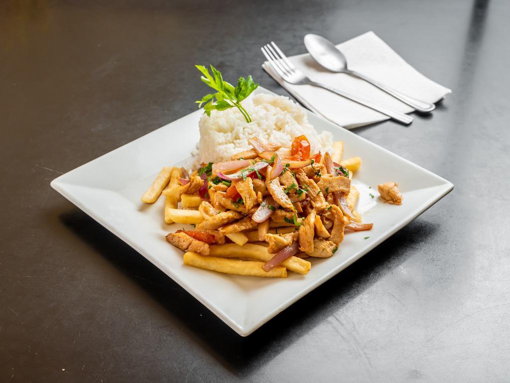 Pollo Saltado · Stir fried chicken pieces sauteed with onion and tomatoes. Served  with french fries and white rice.