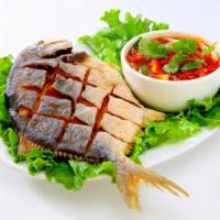 Whole Fish of The Day · Fried or steamed (ask your server) comes with lime chili sauce and sweet chill sauce