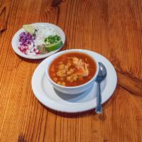 Pozole Soup · Chicken and hominy in a cascabel broth, served with garnishes that includes chopped onions, ...