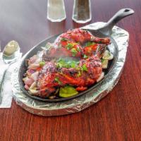 Chicken Tandoori · Leg quarter marinated in spices and yogurt, baked in clay oven.