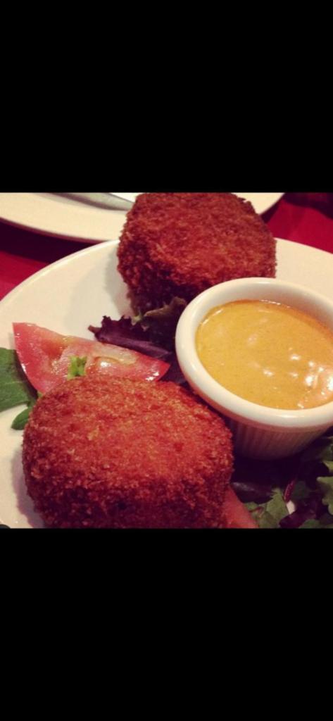 Crab Cakes · Fresh house made crab cakes served with spicy aioli.