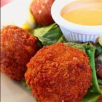 Cajun Shrimp Balls · A mixture of shrimp, corn, rice and Cajun seasoning lightly breaded and fried and served wit...