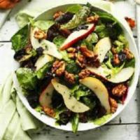 Pear Salad · Mixed greens served with sliced pears, toasted walnuts, crumbled blue cheese and lightly tos...