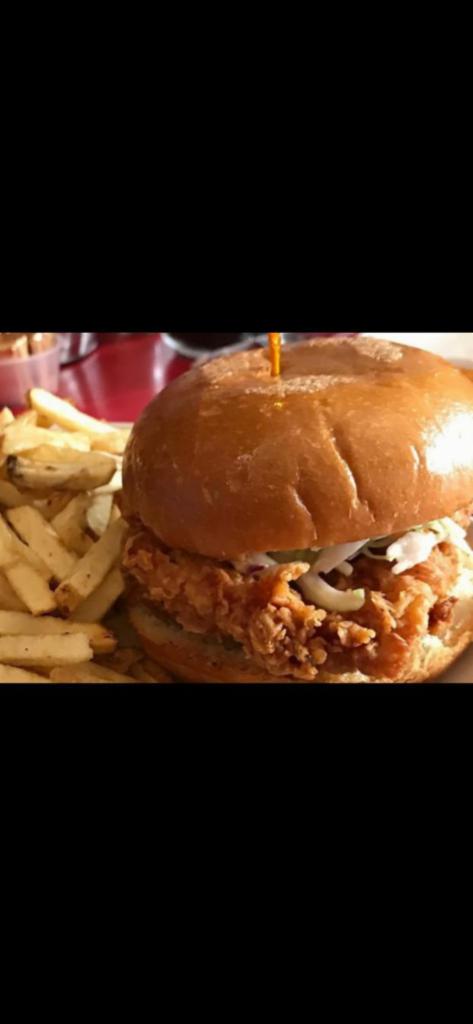 Fried Chicken Breast Sandwich · Fried boneless chicken breast and coleslaw served on a toasted bun with house-made aioli sauce.