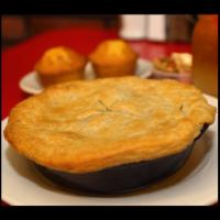 Fried Chicken Pot Pie · Boneless fried chicken, roasted pearl onions, potatoes, carrots and herb gravy topped with a...