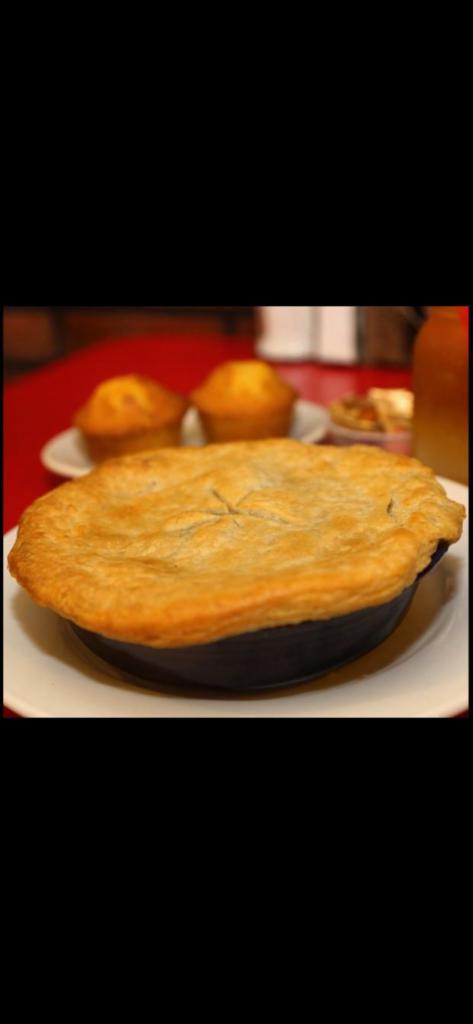 Fried Chicken Pot Pie · Boneless fried chicken, roasted pearl onions, potatoes, carrots and herb gravy topped with a house-made puff pastry.