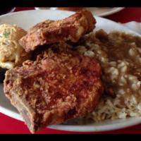 2 Fried Pork Chops · 2 center cut pork chops seasoned and fried to perfection.