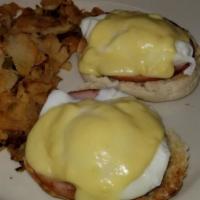 Eggs Benedict Breakfast · 2 poached eggs, Canadian bacon on English muffin topped with Hollandaise sauce. Served with ...