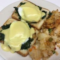 Eggs Florentine Benedict Breakfast · 2 poached eggs with spinach and feta cheese, over a toasted English muffin and topped with H...