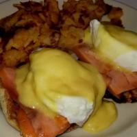 Smoked Salmon Eggs Benedict Breakfast · 2 poached eggs with 4 smoked salmon pieces over a toasted English muffin, topped with Hollan...