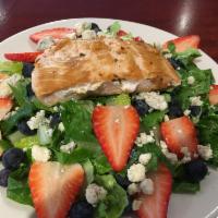 Grilled Salmon Salad · Over spring mix, red cabbage and carrots.