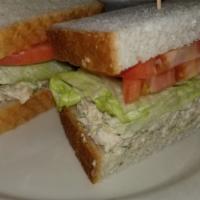 Chicken Salad Sandwich · Served on choice of bread with coleslaw and pickle, lettuce and tomato.