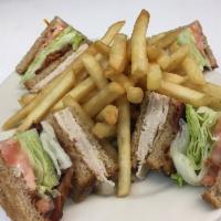 Turkey Club · Bacon, lettuce and tomato. Served with french fries, mayonnaise, coleslaw and pickle.