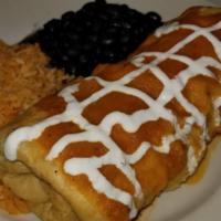 Chimichanga Sunrise · Filled with eggs, ham and cheddar cheese folded and lightly deep fried to a golden brown, to...