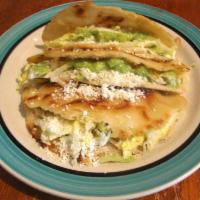 Quesadilla · Homemade corn shell fries to a golden brown stuffed with blended cheese and your choice of b...