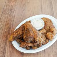 Grilled Catfish Dinner · Includes 2 helpers of your choice and 2 hush puppies.