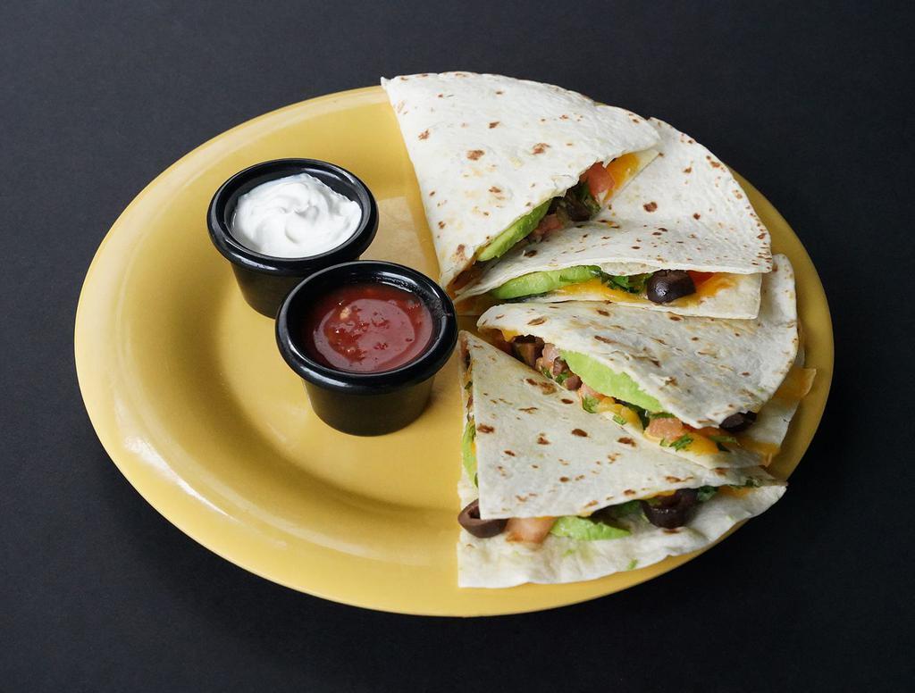 Deluxe Quesadilla · Cheddar Cheese · Diced Tomatoes · Olives · Sliced Avocado · Cilantro · Served with fresh mild red salsa and sour cream on the side.