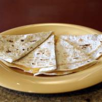 Kid Quesadilla · White or Whole Wheat Tortilla, Cheddar Cheese, Does not include salsa and sour cream.