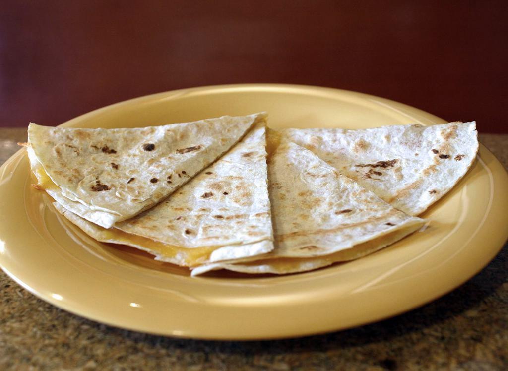 Kid Quesadilla · White or Whole Wheat Tortilla, Cheddar Cheese, Does not include salsa and sour cream.
