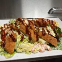 Southwest BBQ Chicken Salad · Mixture of Romaine and Iceberg lettuce, crispy chicken, tomatoes, mozzarella cheese with BBQ...