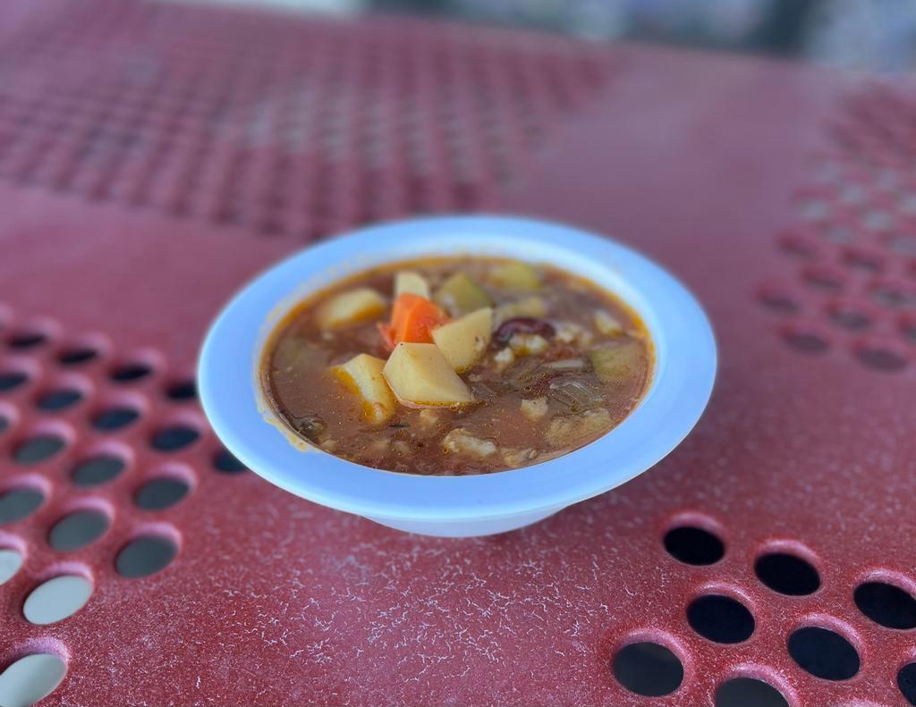 Homemade Minestrone Soup · Soup made with noodles, potatoes, kidney beans, carrots, cauliflower, zucchini, celery & onions in chicken broth.  