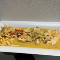 Chicken Angelo Dinner · Sauteed boneless chicken breast, with mushrooms, artichoke hearts, roasted red pepper, white...