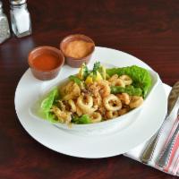 Fried Calamari · Golden fried calamari, shishito peppers, tomato sauce and roasted chili aioli.