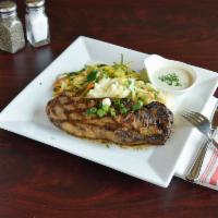 NY Strip Steak · Pan seared all-natural prime steak, mashed potatoes, blue cheese and truffle cream sauce.