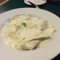 Cheese Ravioli with Alfredo · Ravioli stuffed with cheese, topped with our homemade alfredo sauce.