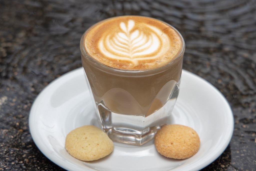 Cortado (5oz) · A classic 5 ounce Cortado drawn with 2 ounces of single origin espresso, topped with 3 ounces of steamed milk and a bit of foam.  The perfect drink for the person who loves flavorful espresso and not an over abundance of steamed milk that one might find in a Latte