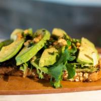 Avocado Toast · Freshly smashed avocado topped with mixed greens, fresh avocado slices ＆ pine nuts with a dr...