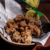 Cape Town Calamari · A Cape Town specialty. Lightly breaded calamari seasoned with lemon zest and fresh cracked p...