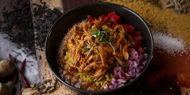South African Curry - Chicken · Since the Seventeenth Century, Indian, Malay and Indonesian communities have been making curries in South Africa. It is one of the most beloved dishes in the country and a signature at Peli Peli. Served with a side of fragrant South African rice pilaf. 
