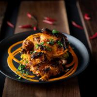 Peli Peli Chicken - Half · Brought to shore by the Portuguese, this spicy African bird’s eye chili sauce, also known as...