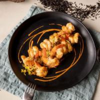 Porto Shrimp - Ten · Gulf shrimp sautéed in garlic butter peli peli sauce, served on fragrant South African rice ...