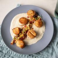 Seared Scallops Trinchado · Six scallops, seared to perfection, served atop a white wine trinchado sauce. Served with a ...