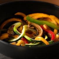 Squash Noodles · Butternut squash and zucchini spirals with duo bell peppers, mushrooms and onions.
