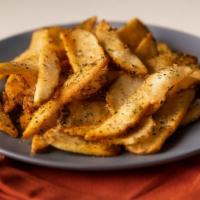 Slap Chips · Cape Dutch-style French fries tossed with South African herbs and spicy biltong seasoning.