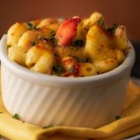 Lobster Mac and Cheese · Cavatappi pasta and Gouda cheese sauce with garlic butter sautéed lobster, topped with a goo...