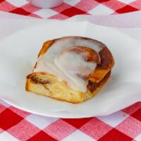 Cinnamon Roll · Cream cheese frosting served warm
